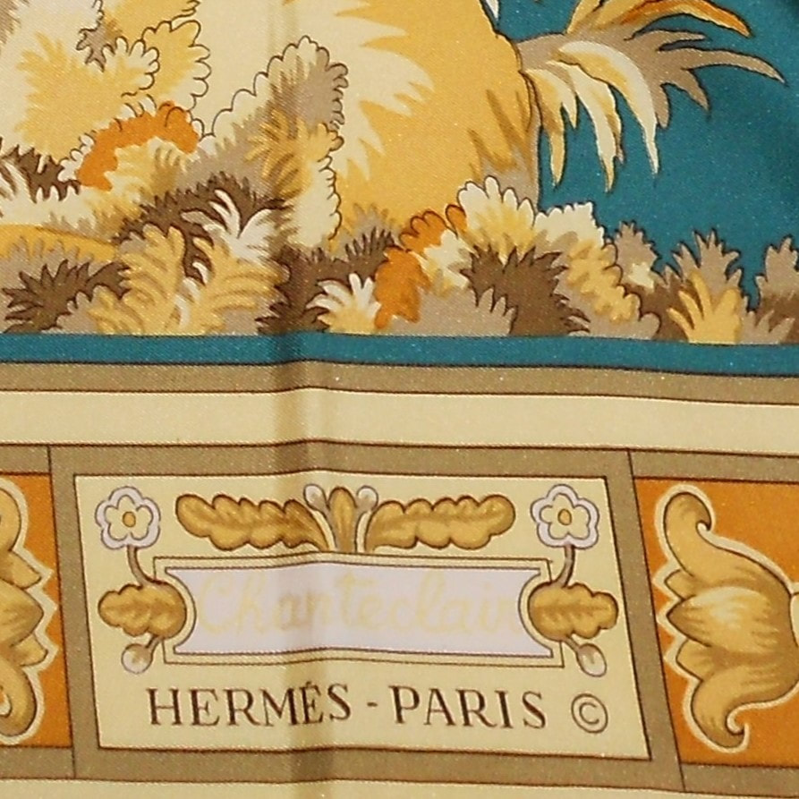 Close up picture of brown Hermes scarf Monsieur et Madame