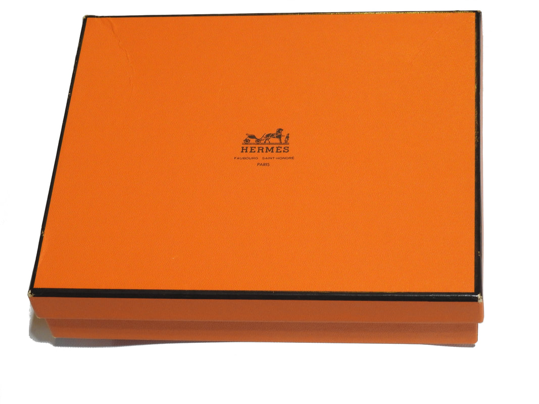 Picture of an orange Hermes scarf box