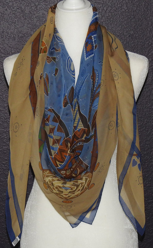 Picture of Reve d'Australie, a 140cm Hermes silk mousseline scarf tied in a cowboy knot