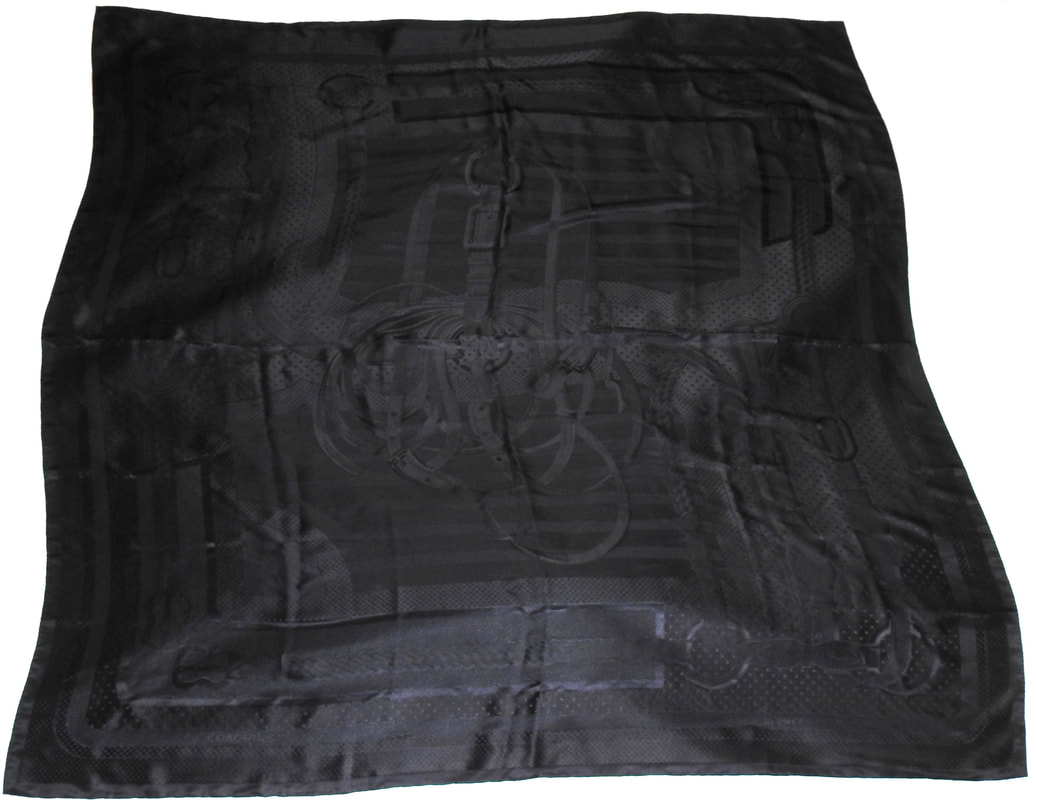 Picture of a 140cm silk jacquard scarf in all black. Coaching by Julia Abadie, 2012