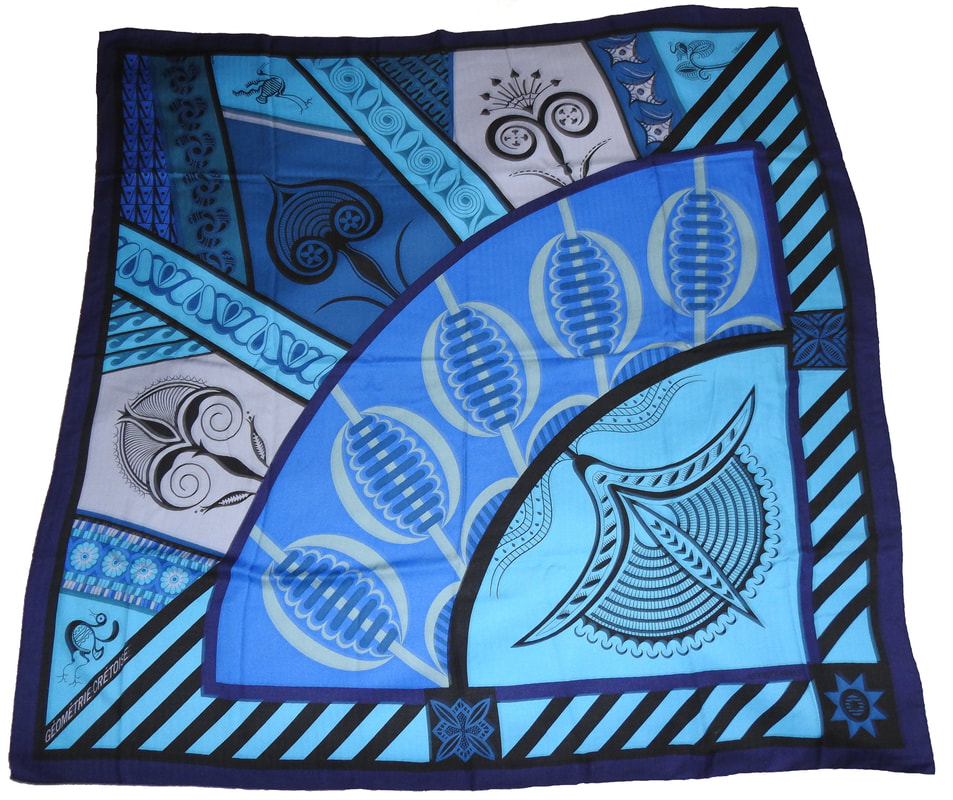 Picture of Geometrie Cretoise, a vintage Hermes 140cm silk cashmere scarf designed by Julia Abadie. Many shades of blue, this is a celebration of Cretian art