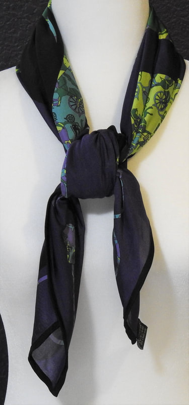 Picture of Hermes silk jersey fluide scarf, Kelly en Caleche, tied in a square knot