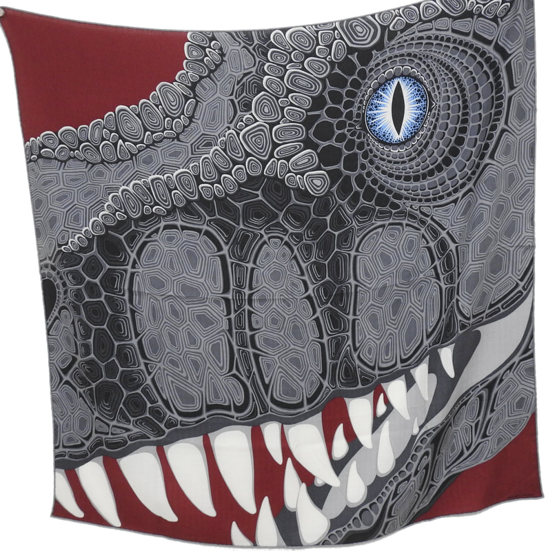 Picture of Aaaaargh!, a cashmere scarf from Hermes designed by Alice Shirley. Grey dinosaur with blue eye against a brick red background.