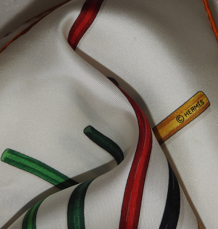 Close up Picture of copyright in used Hermes scarf for sale A Vos Crayons