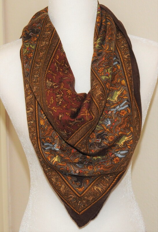 Picture of used brown Hermes cashmere 90cm scarf for sale Chasse en Inde knotted in a simple triangle