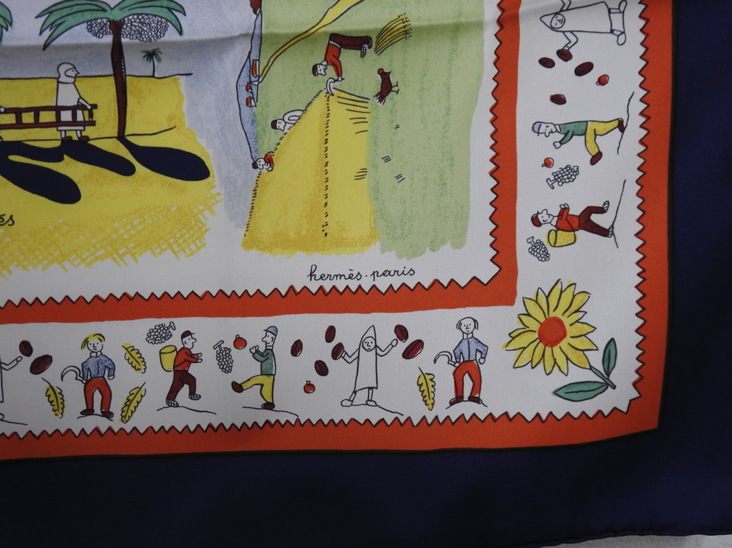 Close up picture of the Hermes brand appearing in a used Hermes scarf Retour a la Terre
