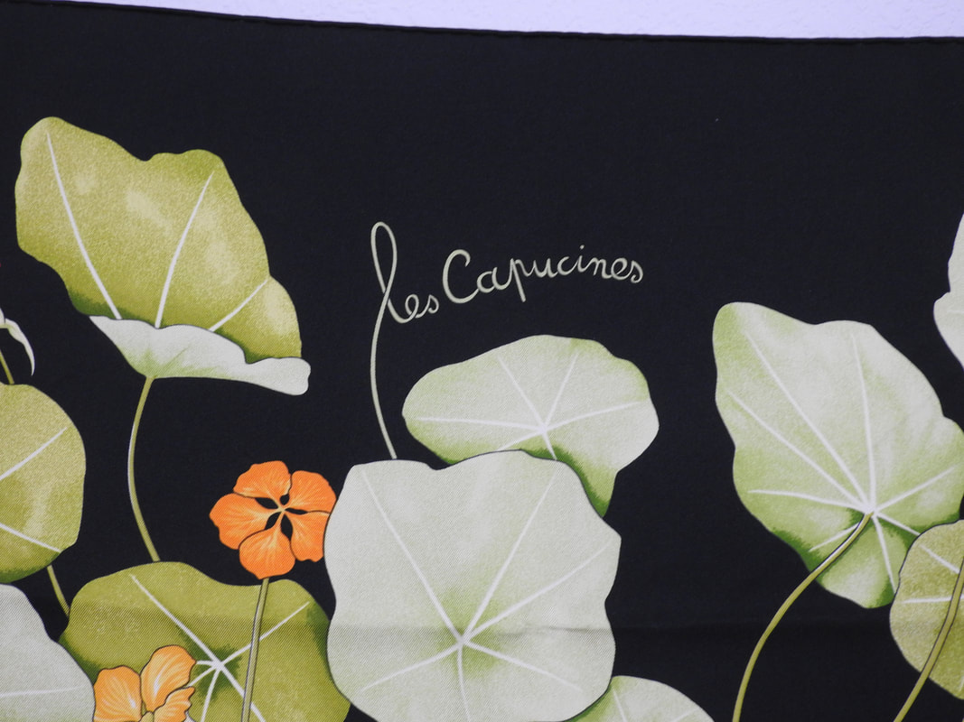Close up picture of Les Capucines, a vintage Hermes silk scarf designed by Antoine de Jacquelot