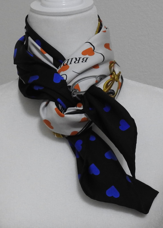 Picture of used Hermes 90cm silk scarf for sale. Brides de Gala Love is tied in a braided hacking knot