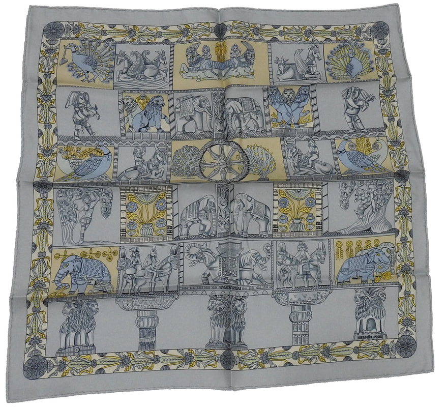 Picture of a 45cm Hermes silk scarf, Torana by Annie Faivre. Light blue and creme colors depict arched entryways large enough to allow elephants to pass