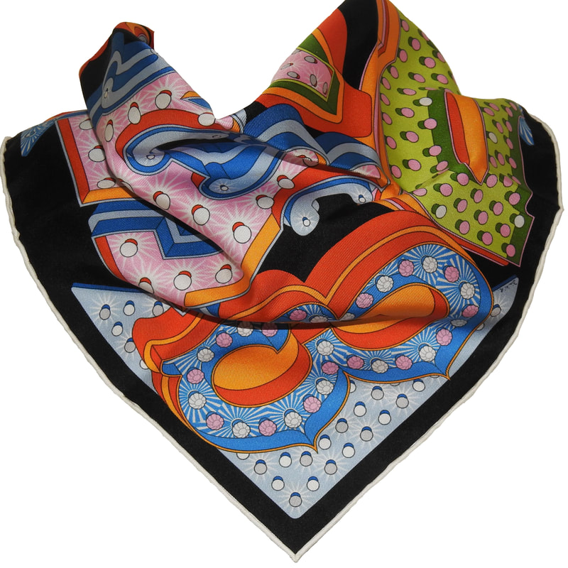 Picture of a 45cm Hermes silk scarf, Hermes Electrique. Tied in a simple cowboy knot