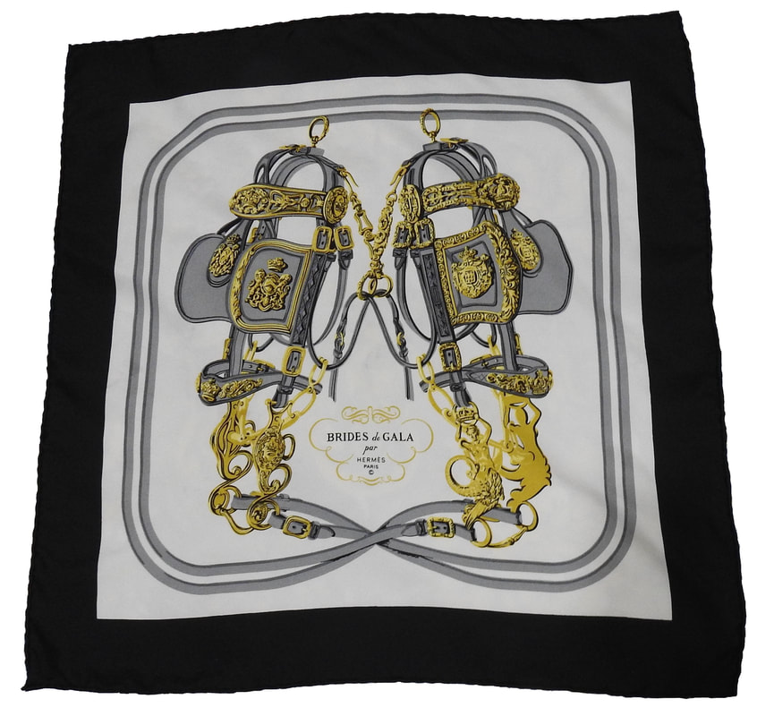 Picture of a 45cm Hermes silk scarf, Brides de Gala by Hugo Grykgar. A pair of ceremonial bridles on a white background with a black border.