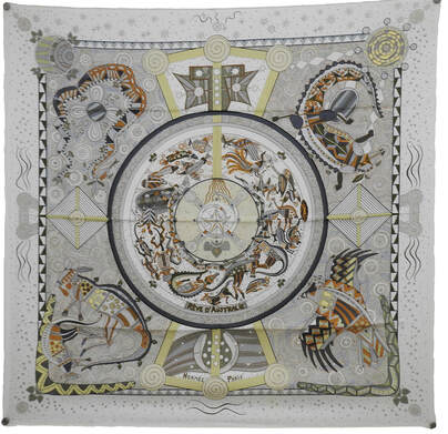 Picture of Reve d'Australie, a 90cm silk Hermes scarf designed by Zoe Pauwels. White with grey, yellow and brown. This depicts Australian wildlife in aboriginal dream time styling.