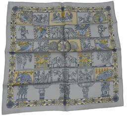 Picture of a 45cm Hermes silk scarf, Torana by Annie Faivre. This light blue scarf features Indian elephants and gateways to Hindu and Buddhist shrines of India