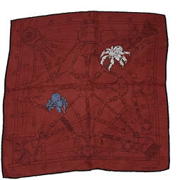 Picture of 45cm silk mens scarf from Hermes. Flamboyant Web features two robot spiders weaving a mechanical web. Brick red with black contrast hem.
