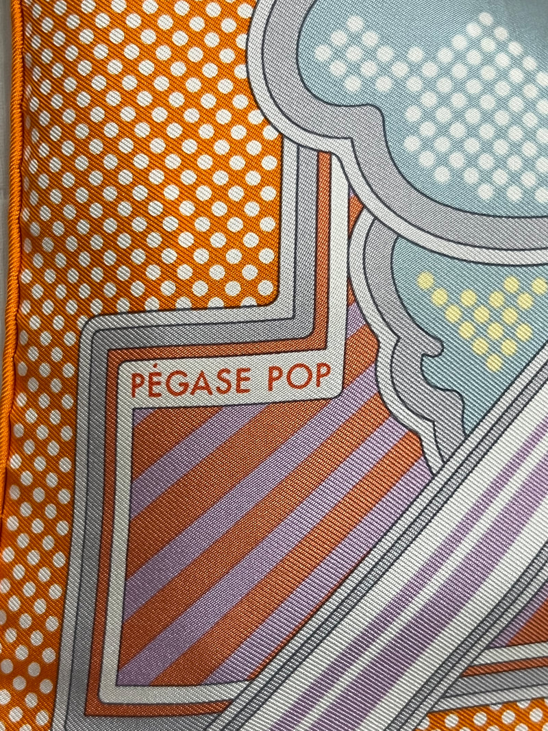 Close up picture of the scarf title and artist signature appearing in a used 70cm Hermes scarf Pegasus Pop
