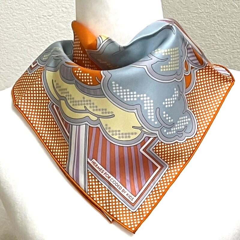 Picture of Pegasus Pop, a 70cm silk Hermes scarf, tied around the neck