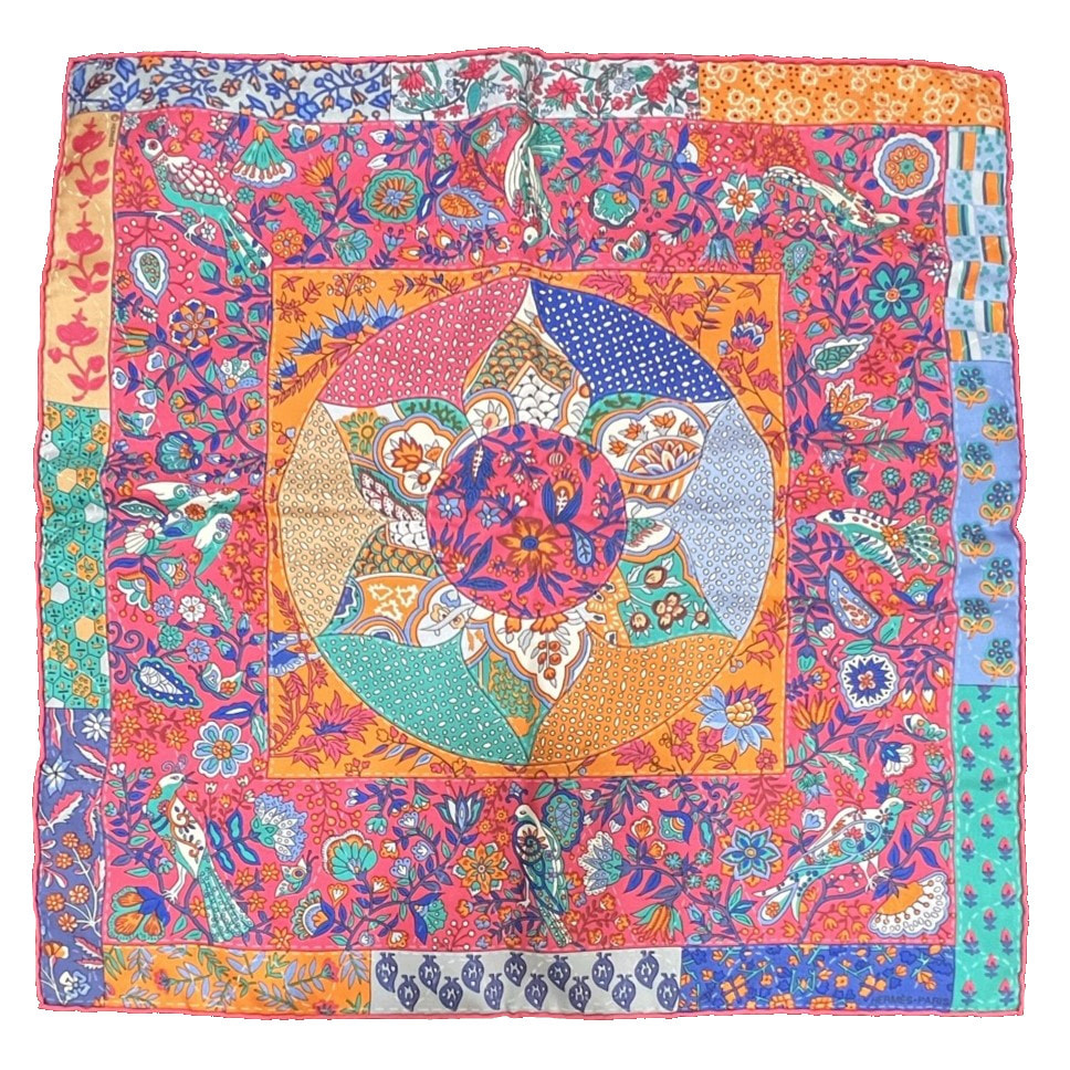 Picture of Pique Fleuri, a 45cm silk scarf designed by Christine Henry for Hermes. Brightly colored quilt pattern