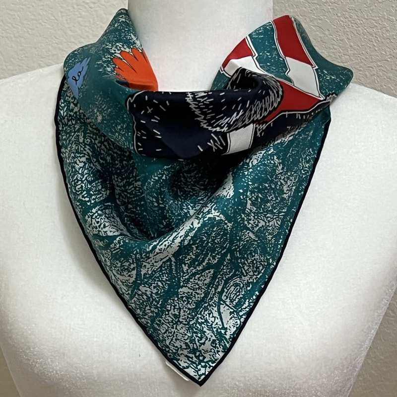 Picture of Amis Pour la Vie, a used Hermes 45cm silk scarf for sale, knotted in a loose cowboy knot. This is a green scarf with black hem, featuring Little Red Riding Hood holding a black wolf in her arms