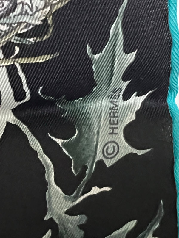 Picture of Hermes copyright symbol appearing on used 70cm Hermes silk scarf Texas Wildlife