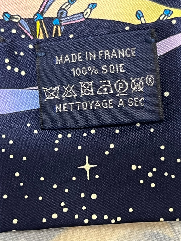Picture of Hermes branding appearing on used Hermes silk twilly Space Derby