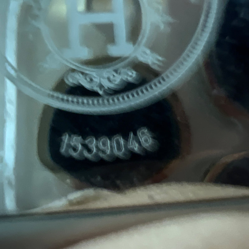 Picture of back of Hermes Belt watch face showing serial number 1539048