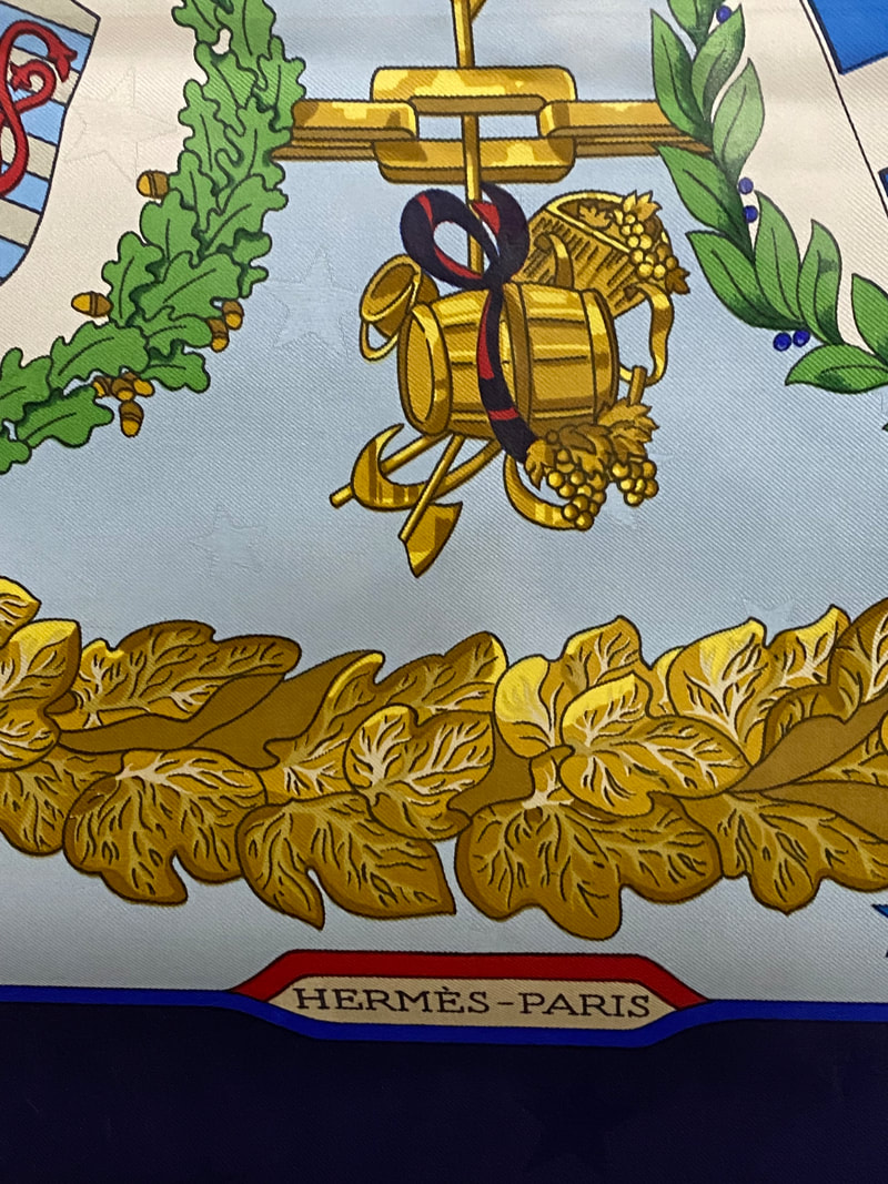 Close up picture of the Hermes brand appearing in a used Hermes scarf Emblemes de l'Europe