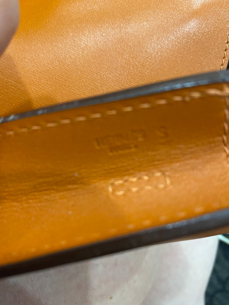 Picture of exterior brand stamp on Hermes Onimaitou orange box calfskin leather crossbody bag