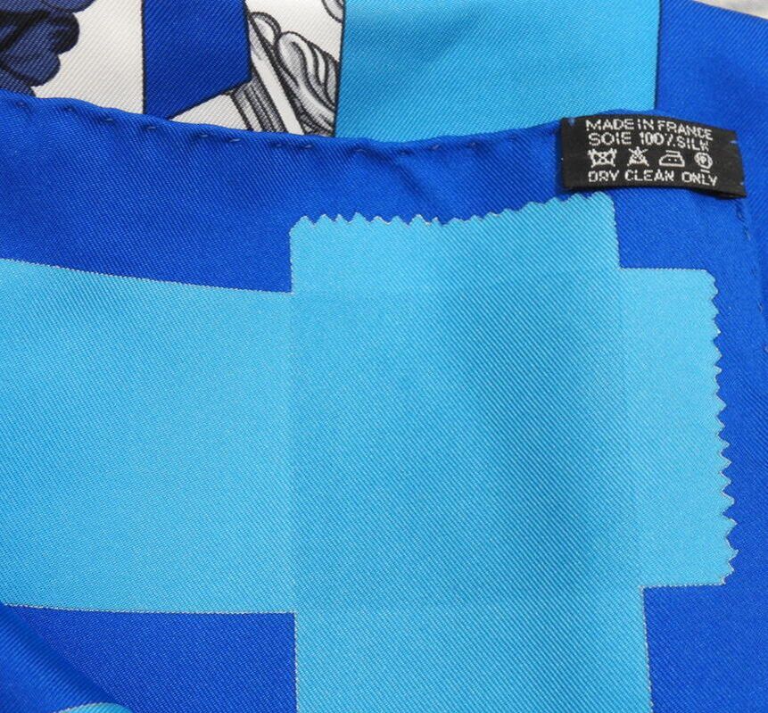 Close-up Picture of caretag on used Hermes 90cm silk scarf Tout en Carre