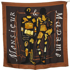 Picture of used vintage Hermes 90cm silk scarf, Monsieur et Madame by Bali Barret, issued in 2006. Brown and gold.