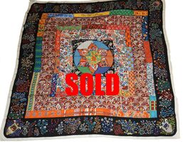 Picture of used Hermes cashmere shawl for sale. Pique Fleuri en Provence by Christine Abadie. Multi color floral on black background with white border