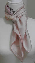 Picture of Shackleton, a pink Hermes silk scarf, tied in a braided hacking knot