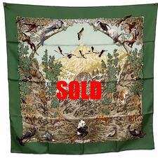 Picture of Hermes 90cm silk scarf, Sichuan, by Robert Dallet. This green scarf was issued in 1995 and features a panda and birds ad a jaguar in a Chinese mountain setting