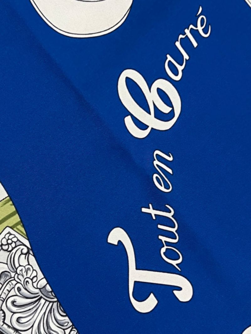 Close up Picture of title of blue Hermes 90cm silk scarf Tout en Carre
